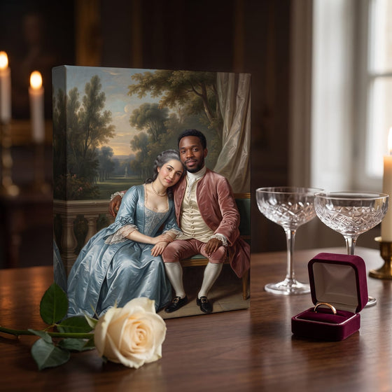 A small gallery canvas portrait of a young couple beside champagne coupes, an ivory rose and a ring box